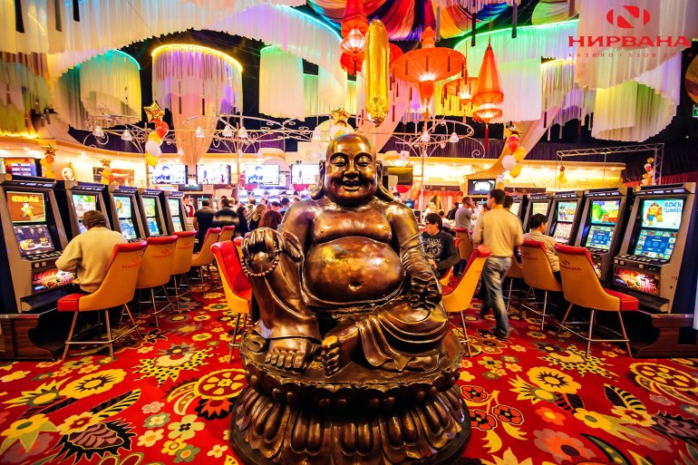 A large Buddha statue in the casino gaming hall