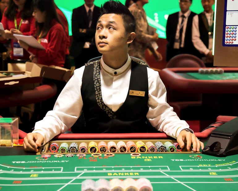 Croupier at the table