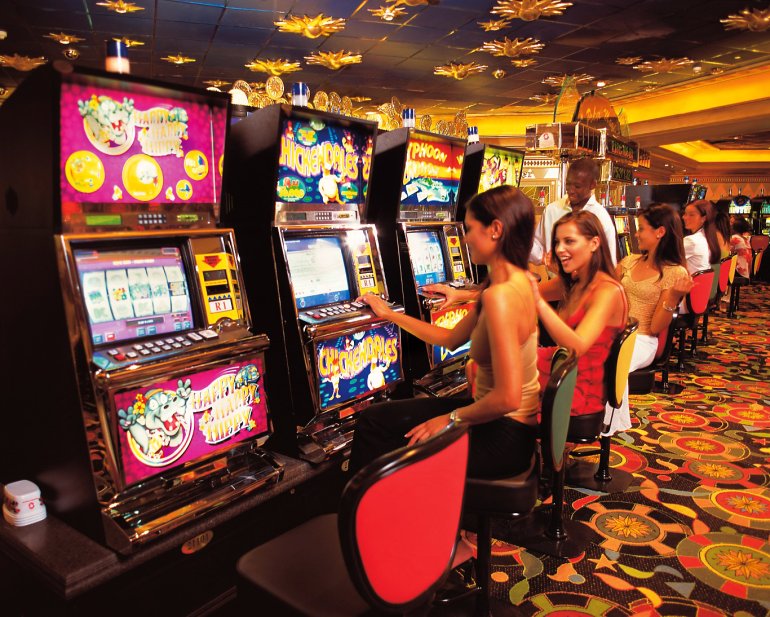 Ladies play on their favorite Lucky slot in the casino