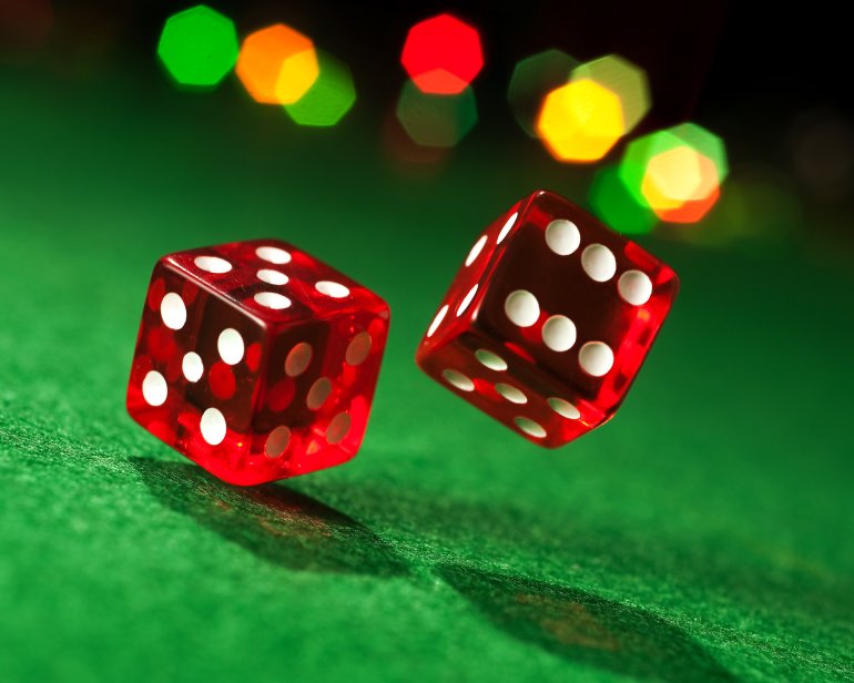 Red dice on a green background