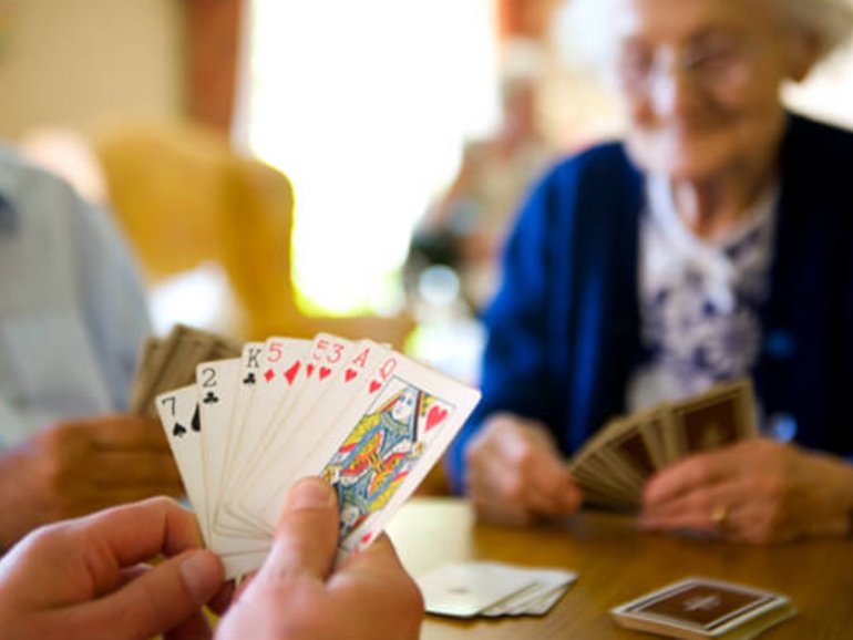 Elderly People Playing Cards