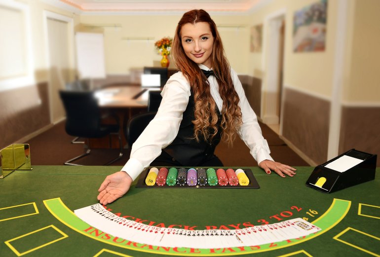 The dealer's girlfriend offers to play
