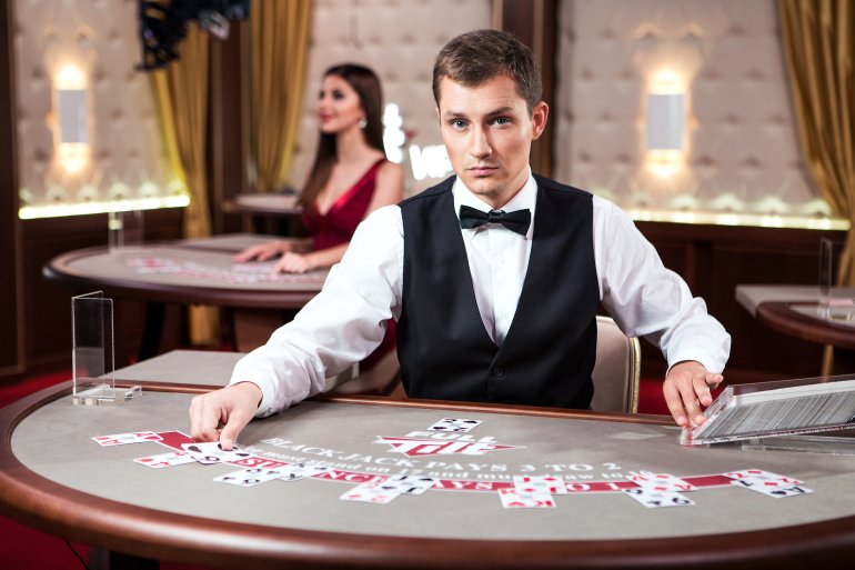 A blackjack dealer in a casino