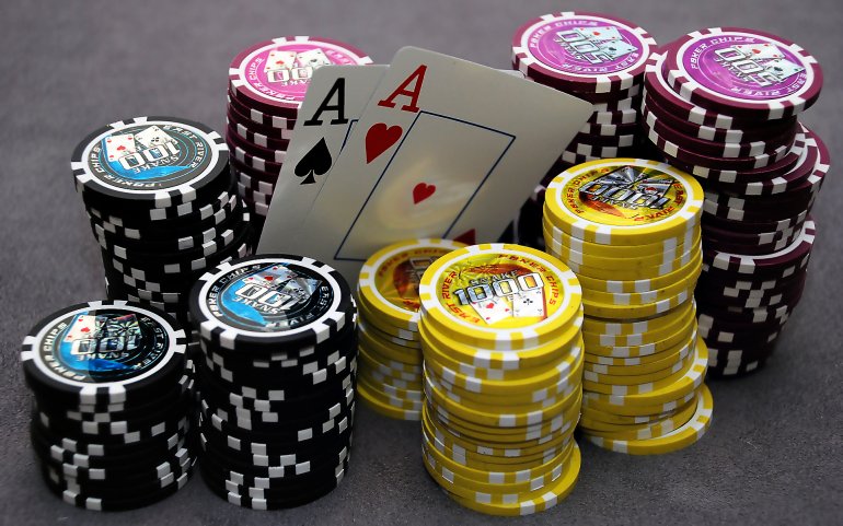 Piles of chips and 2 aces