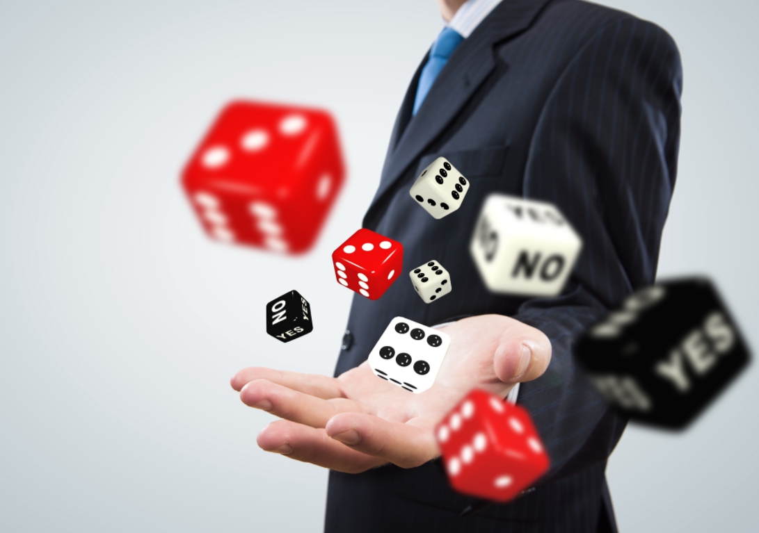 casino player A man in a suit throws red and black dice yes no