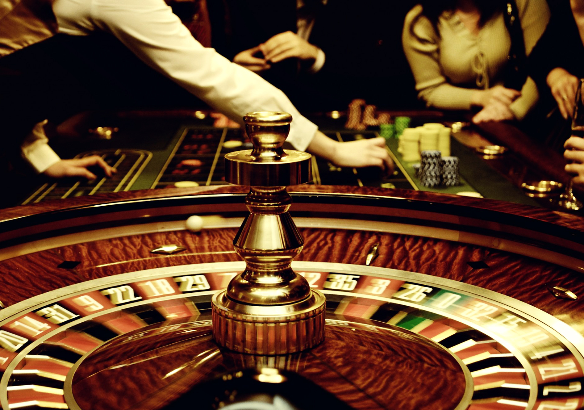 A croupier launches a roulette ball in a casino Playing roulette in a casino